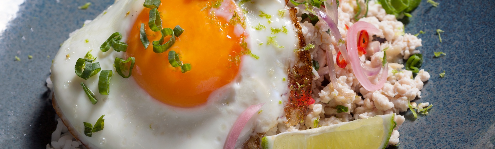 Pad Krapao chicken mince with steamed rice, fried egg and fresh coriander