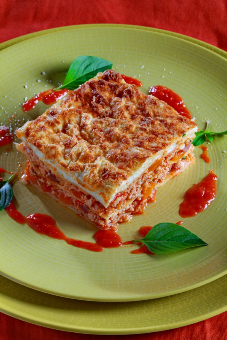 Lasagna with ground beef, vegetables and prosciutto