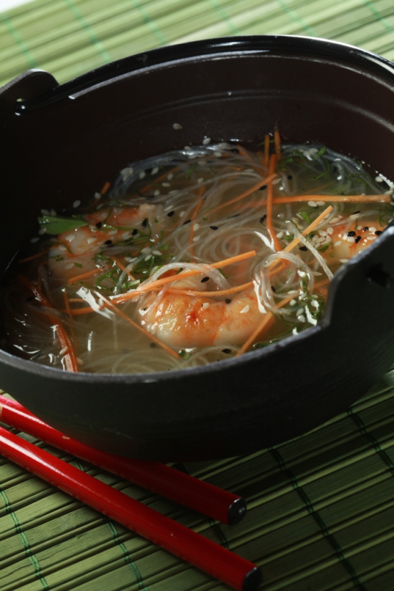 Carrot consommé with lemongrass, ginger, spicy Asian grilled shrimp, and bean threads